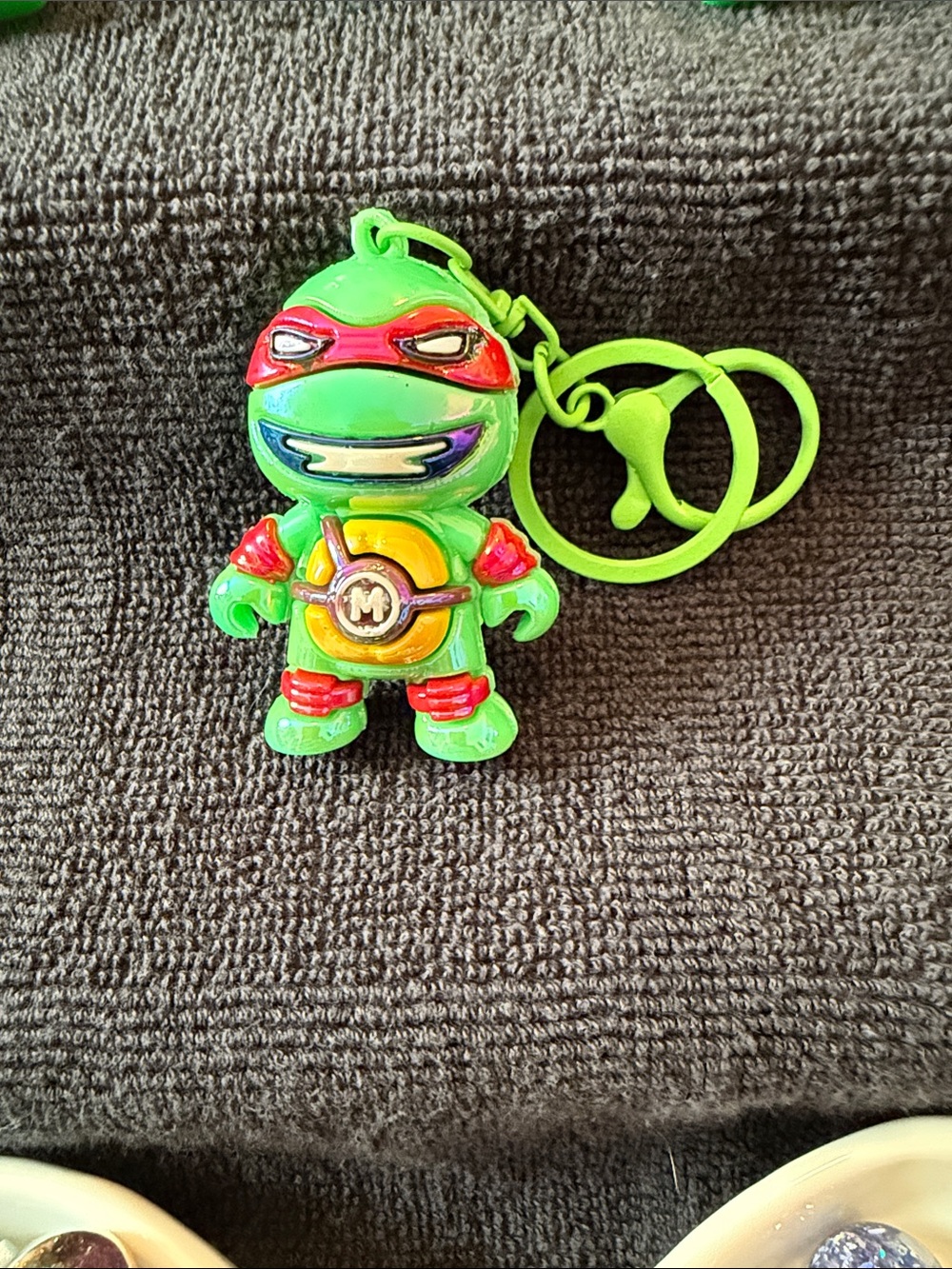 Neon Green Turtle Keychain Figure with Red and Yellow Accents